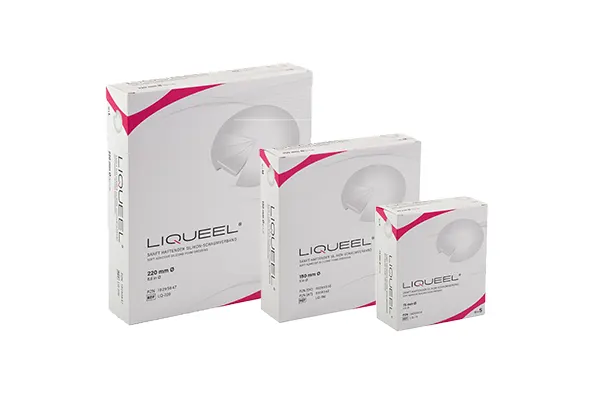 LIQUEEL, weiße Verpackung pinkfarbene Ecken, runde Wundauflage mit Perforationen.